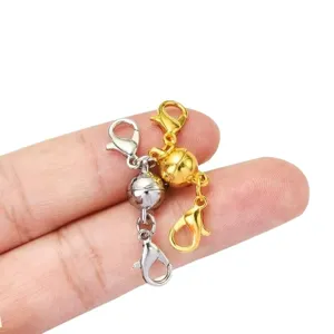 Close-up of magnetic ball clasps with lobster clasps for DIY jewelry accessories.