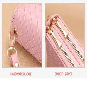 Pink woven leather wallet detail showing gold hardware buckle and smooth double zippers.