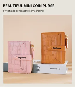 Close-up detail of stylish mini coin purse with crocodile pattern, compact folding design.