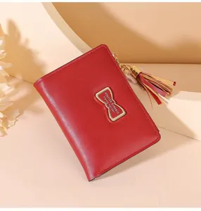 Red short women wallet purse with metal bow and tassel pendant, stylish compact card holder.