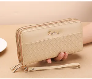 Detailed view of the woven leather double zipper long wallet with wrist strap chic.