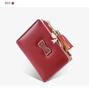 Red short women wallet with zipper pocket and cute bow metal decor for daily casual use.