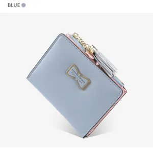 Short women bifold wallet with bow metal plate and tassel zipper in stylish blue design.