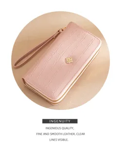 Pink double zipper long wallet detail, crocodile texture leather with gold hardware.