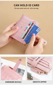 Pink short wallet with multi card slots crocodile pattern detail view showing zipper and snap.