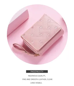 Pink women short wallet with heart embroidery and wrist strap, compact tri fold design.