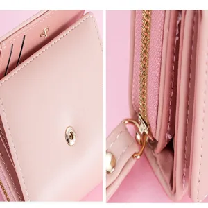 Women pink short wallet hardware and zipper detail view showcasing compact design and stitching.