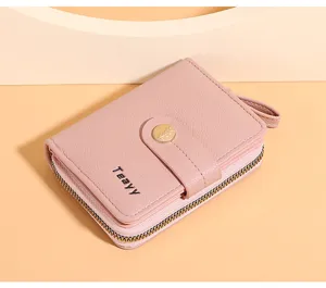 Close-up detail of the pink short wallet, showing textured PU leather and zipper pocket.