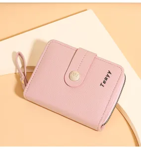 Pink short women wallet with snap closure zipper design and compact card slots fashion daily.