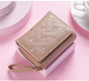 Women short wallet detail shot showcasing cute heart embroidery pattern and compact size.