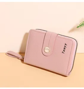Pink short wallet for women with zipper coin pocket, card slots, and cute leaf snap button.