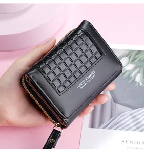 Close-up detail shot of a black short wallet with grid texture, zipper, and wrist strap.