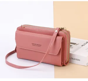 Sac bandoulière téléphone portable femme en cuir PU rose long portefeuille à double fermeture.