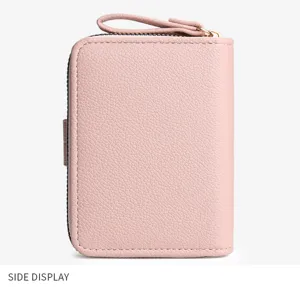 Pink women's short wallet side view, premium textured PU leather with zipper and compact design.