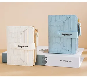 Detailed view of women short PU leather wallet with multi card slots and coin pocket.
