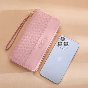 Pink woven long wallet for women, large capacity zip clutch purse with wrist strap and phone slot.