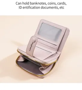 Close-up view of pink short wallet interior showing card slots and zipper details.