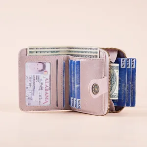 Portafoglio corto rosa da donna in pelle cerata con zip e porta carte multipli.