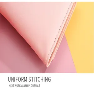 Close-up detail shot of pink leather wallet, delicate stitching, premium texture and neat finish.