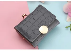 Compact gray crocodile pattern short wallet with metal kiss lock and snap closure for women.
