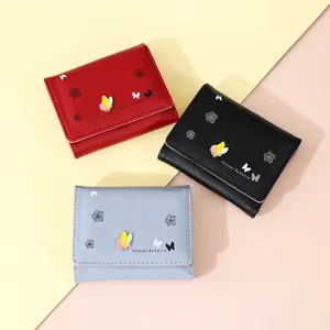 Chic short women wallet PU leather mini coin purse with cute butterfly metal decor and floral print.