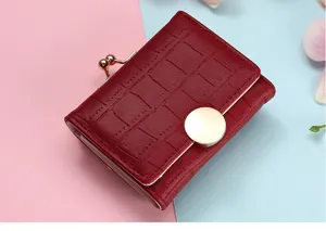 Wine red short wallet detail, women's folding purse with kiss lock and round metal buckle.