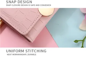 Close-up detail of women pink short folding wallet with chic snap button and texture.