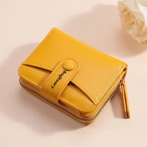 Yellow women's short wallet with zipper coin pocket, snap closure and multiple card slots.