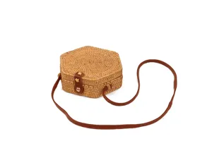 Handwoven hexagonal rattan crossbody bag with brown leather strap for women summer beach.
