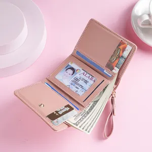 Stylish pink women's short wallet featuring card slots, coin pocket and ID window.