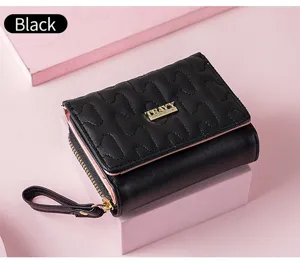 Schwarze kurze Damen Portemonnaie mit Stepp Design, rosa Rand und Kartenfaechern mit Reissverschluss.