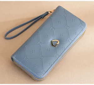 Women's blue long double zipper wallet with wrist strap and heart decor detail view