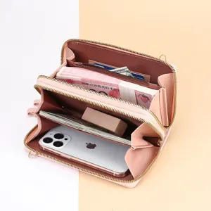 Élégant portefeuille rose pour femme à double fermeture éclair et sac bandoulière pour téléphone.