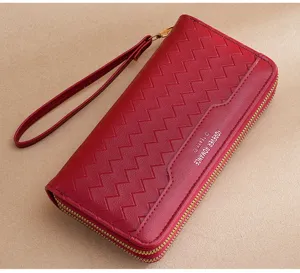 Red long women's wallet with wrist strap zipper closure and stylish textured design.