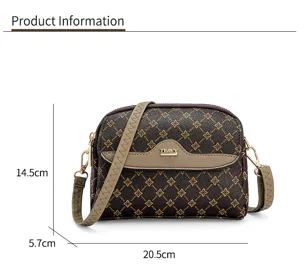 Details of the stylish monogram cross-body bag showing compact structure and metal plaque.