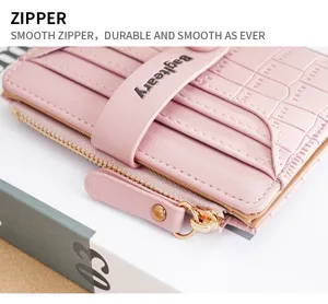 Pink short wallet for women with card slots zipper coin pocket and chic crocodile pattern.