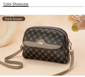 Stylish women's monogram crossbody bag with double zippers, retro design for casual daily wear.