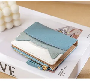 Mini multi-color leather wallet for women with cute cat ear card slots and zipper pocket.