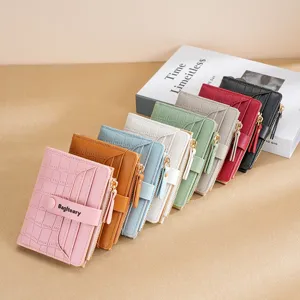 Women's short PU leather wallet with multiple card slots, zipper coin pocket and snap closure.
