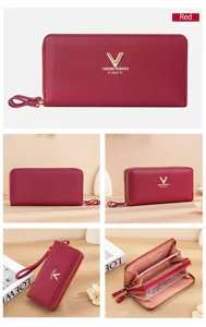 Detailed view of women's long zip wallet, multiple card slots and compartments in red color.