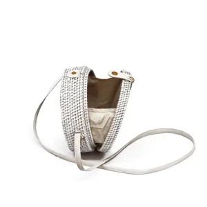 White woven round rattan crossbody bag for women, stylish straw shoulder bag with leather strap.