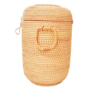 Handmade Vietnamese rattan tea storage jar, cylindrical design with lid for Pu-erh tea.