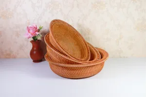 Handmade natural rattan woven fruit basket detail showing intricate texture and sturdy structure.