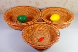 Round woven rattan fruit baskets set of three for home kitchen living room organization.