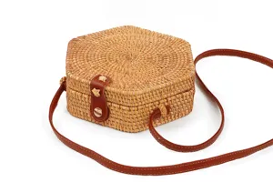 Hexagonal rattan woven crossbody bag for women, stylish straw shoulder bag with leather strap.