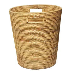 Natural rattan woven laundry basket, durable wicker storage hamper for home clothes organization.
