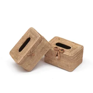 Handmade rattan tissue box for home desktop decoration, natural woven storage container.