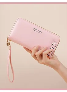 Stylish pink PU leather long wallet with wrist strap and cute cat detail for women.