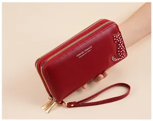Red PU leather long wallet detail showing double zippers and cute cat pattern design.