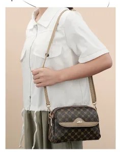 Chic women's monogram crossbody bag with adjustable strap, stylish and versatile daily.